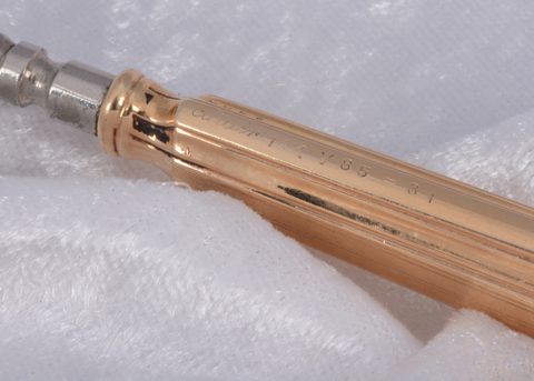 A Cartier 14k marked gold handled button hook