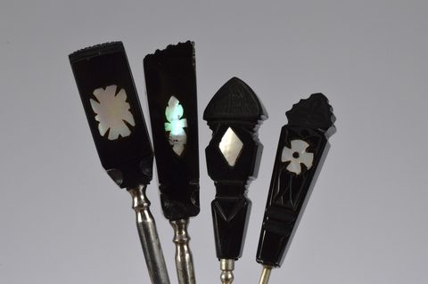 A collection of 19th and 20th Century Whitby jet handled button and glove hooks