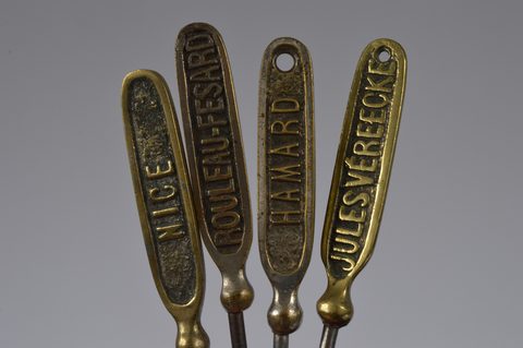 A collection of 19th Century steel and brass flattened souvenir button hooks