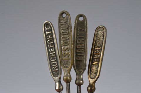 A collection of 19th Century steel and brass flattened souvenir button hooks