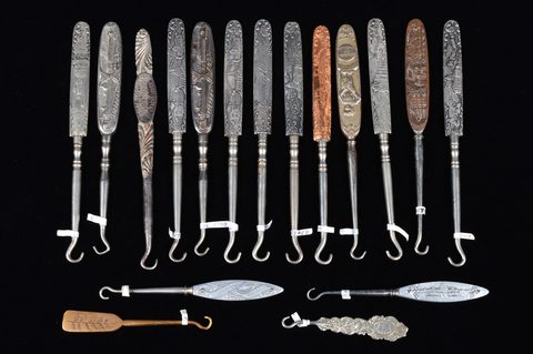 A collection of 19th Century steel and brass flattened souvenir button hooks