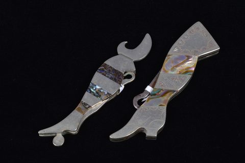 A collection of abalone and mother of pearl handled retractable handbag or pocket button hooks