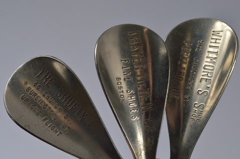 A collection of advertising steel combination button hook or loop and shoehorns