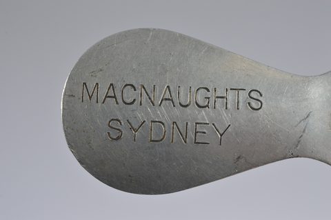 A collection of advertising steel combination button hook or loop and shoehorns
