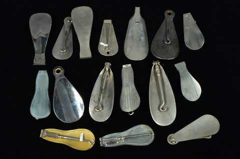 A collection of chromed and steel combination button hooks and loops and shoehorns