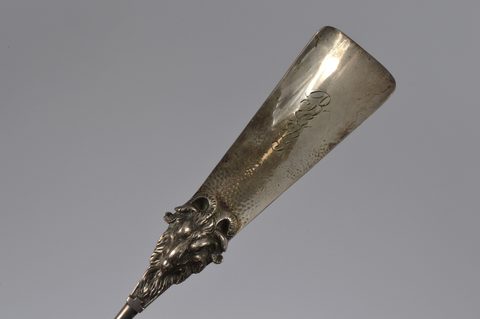 A collection of combination button hook and shoe horns