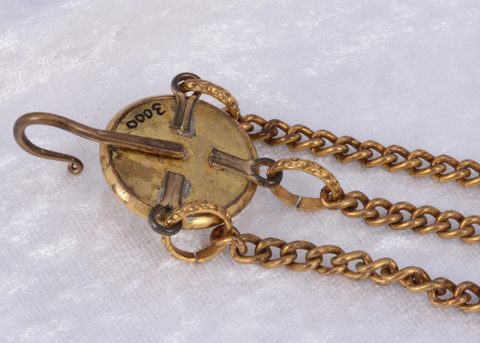 A collection of gilt metal novelty lapel button hooks