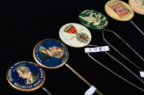 A collection of late 19th and early 20th Century advertising button hooks and loops