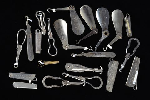 A collection of retractable hinged advertising steel button hooks