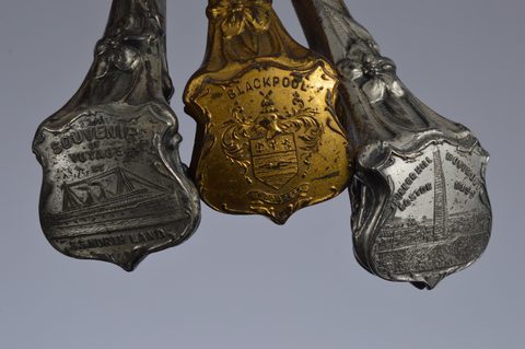 A collection of souvenir button hooks