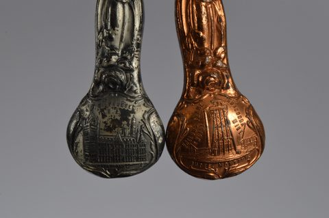 A collection of souvenir button hooks