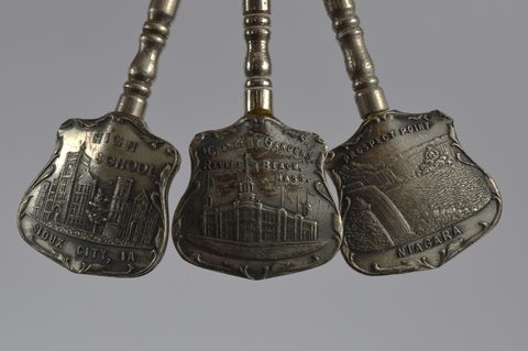 A collection of souvenir button hooks