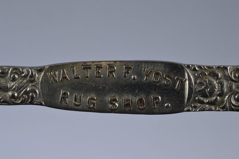 A collection of steel advertising button hooks