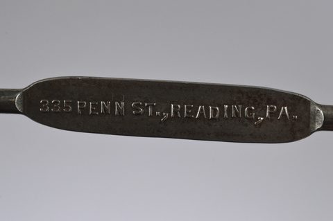 A collection of steel advertising button hooks