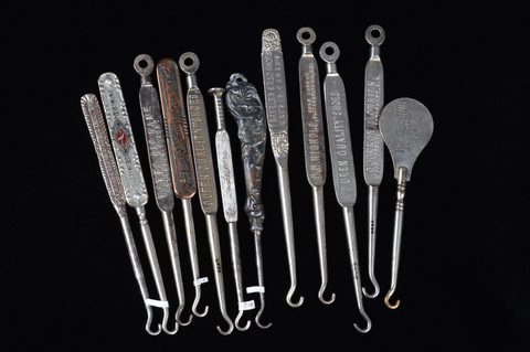 A collection of steel advertising  button hooks