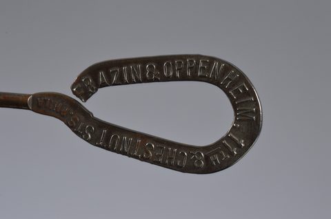 A collection of steel advertising button hooks