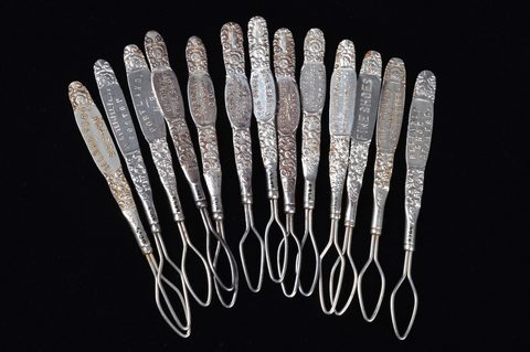 A collection of steel advertising  button loops