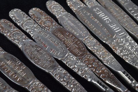 A collection of steel advertising  button loops