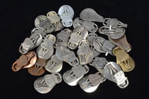 A collection of steel and brass 19th Century folding commemorative or souvenir shoehorn button hooks