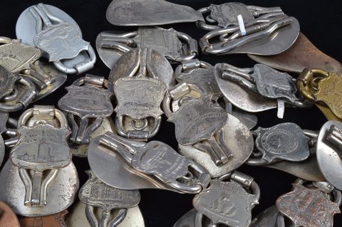 A collection of steel and brass 19th Century folding commemorative or souvenir shoehorn button hooks