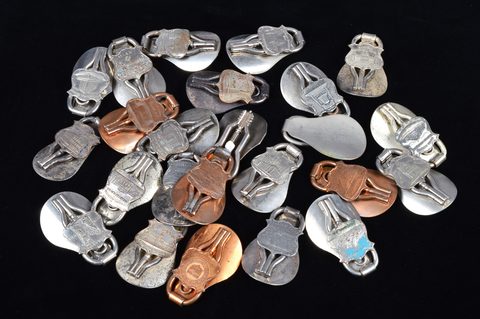 A collection of steel and brass 19th Century folding commemorative or souvenir shoehorn button hooks
