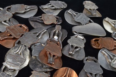A collection of steel and brass 19th Century folding commemorative or souvenir shoehorn button hooks