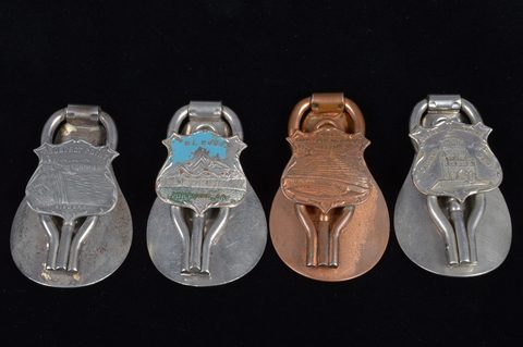 A collection of steel and brass 19th Century folding commemorative or souvenir shoehorn button hooks