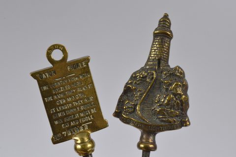 A collection of steel brass handle mounted souvenir and commemorative button hooks