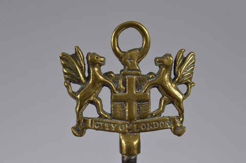 A collection of steel brass handle mounted souvenir and commemorative button hooks