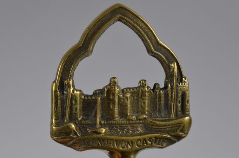 A collection of steel brass handle mounted souvenir and commemorative button hooks