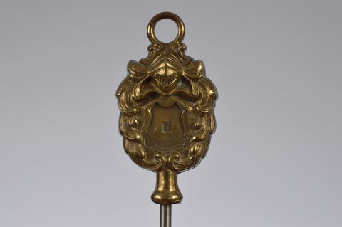 A collection of steel brass handle mounted souvenir and commemorative button hooks