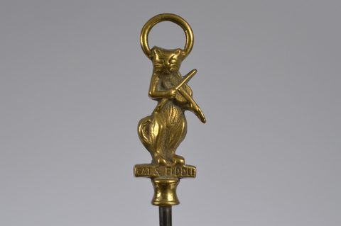 A collection of steel brass handle mounted souvenir and commemorative button hooks