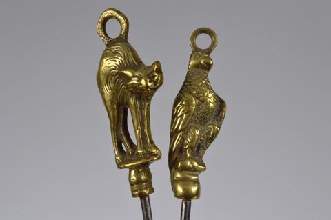 A collection of steel brass handle mounted souvenir and commemorative button hooks