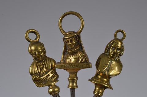 A collection of steel brass handle mounted souvenir and commemorative button hooks