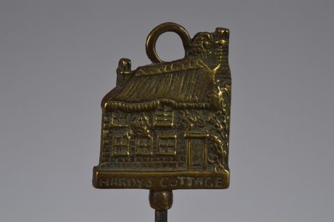 A collection of steel brass handle mounted souvenir and commemorative button hooks