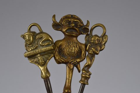 A collection of steel brass handle mounted souvenir and commemorative button hooks