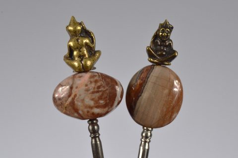 A collection of steel brass handle mounted souvenir and commemorative button hooks
