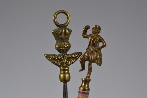 A collection of steel brass handle mounted souvenir and commemorative button hooks