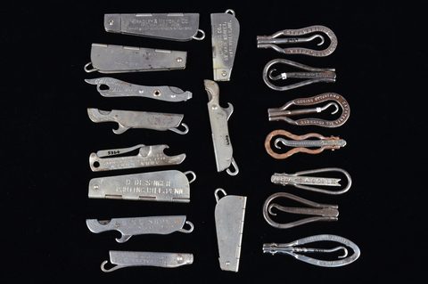 A collection of steel hinged retractable advertising button hooks