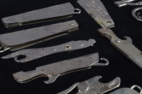 A collection of steel hinged retractable advertising button hooks