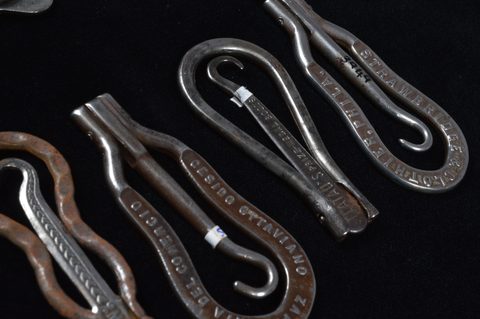 A collection of steel hinged retractable advertising button hooks