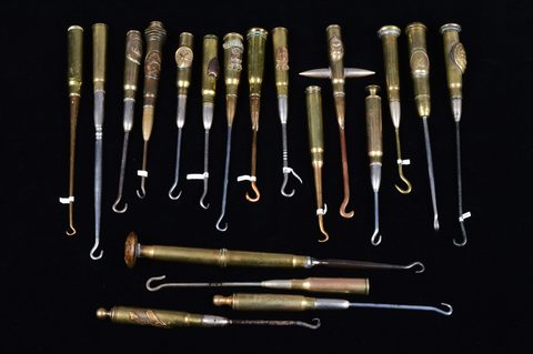 A collection of trench art converted shell button hooks