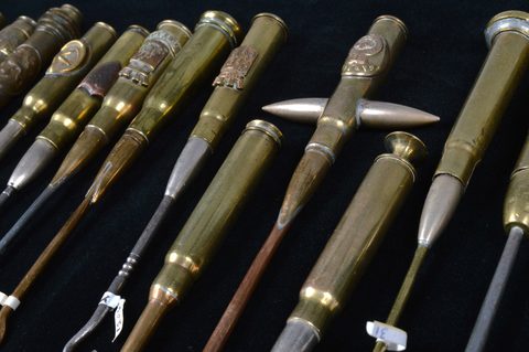 A collection of trench art converted shell button hooks