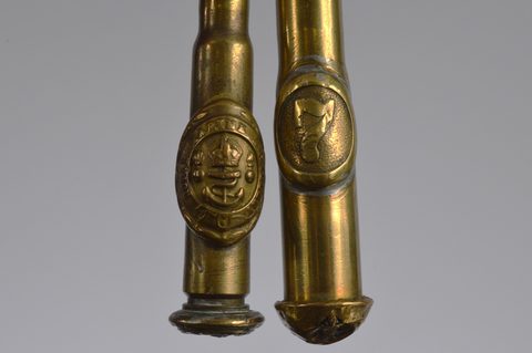 A collection of trench art converted shell button hooks