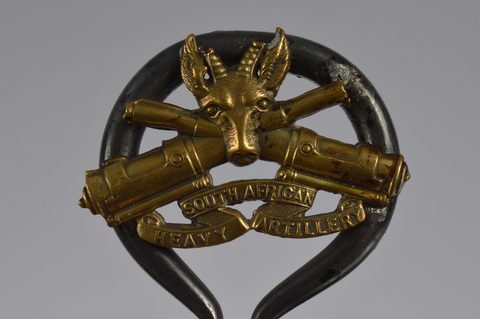 A collection of trench art converted shell button hooks and accessories