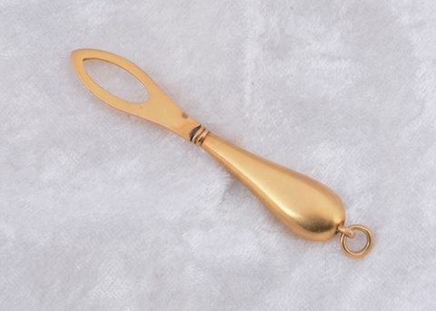 A continental yellow metal diamond set button loop