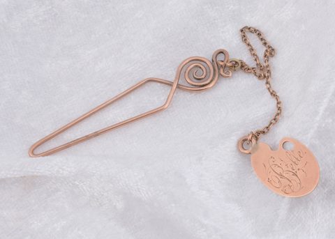 A novelty fob and loop button hook