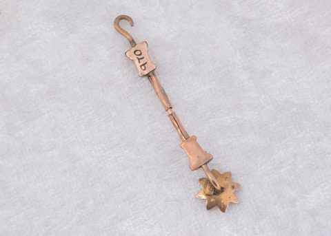 A novelty Victorian stick pin button hook