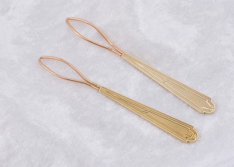A pair of Tiffany & Co button loops