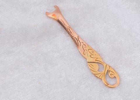 A Tiffany & Co yellow metal art nouveau button hook